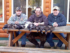 duck hunters with their birds